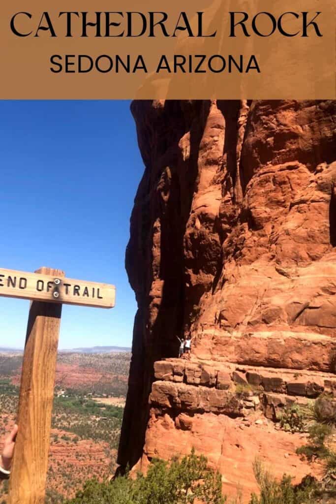 end of trail sign with mom and son on the edge of a cliff in the background with a sign at the top that states Cathedral Rock Sedona Arizona