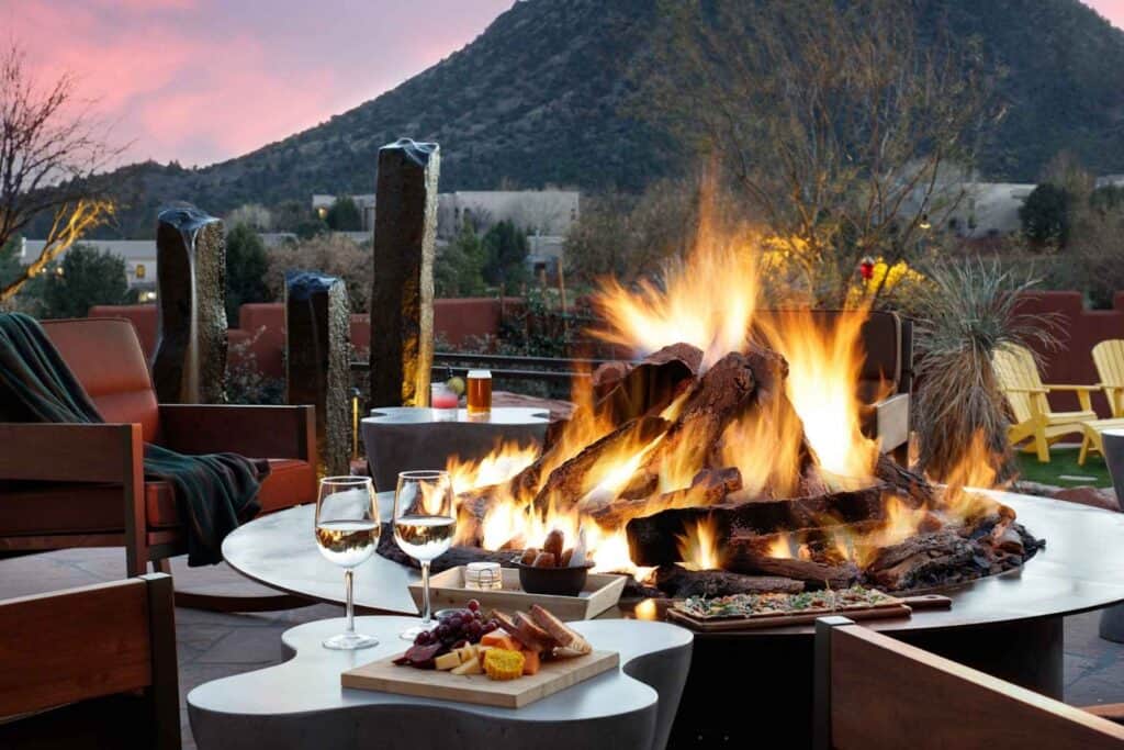 Outdoor fire pit seating area at Hilton Sedona Resort at Bell Rock in Sedona Arizona at sunset