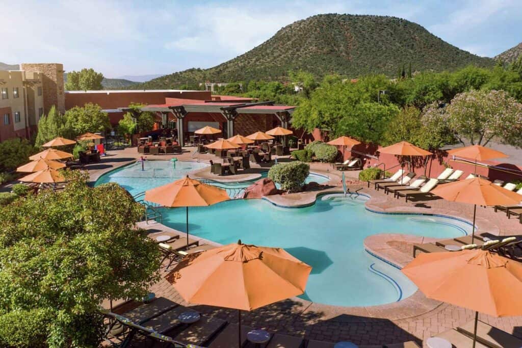 Family pool area at Hilton Sedona Resort at Bell Rock in Sedona Arizona with red rock views